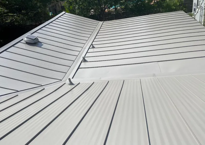 Solar attic fan installed on a metal roof for Roof Ventilation in Azalea Park